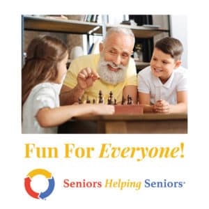 Fun for Everyone! Games and puzzles for seniors - senior gentleman with 2 children at a chess board