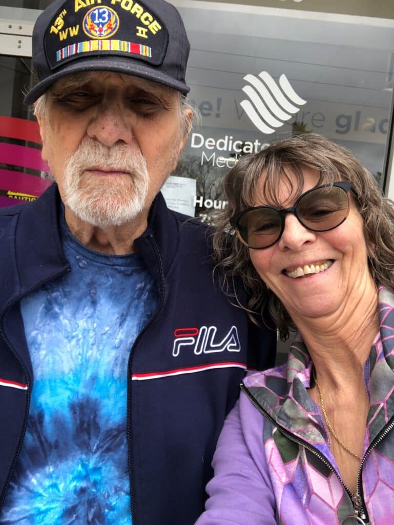 Seniors Helping Seniors caregiver takes a joyful selfie with Air Force veteran client during a Bradenton home care visit.