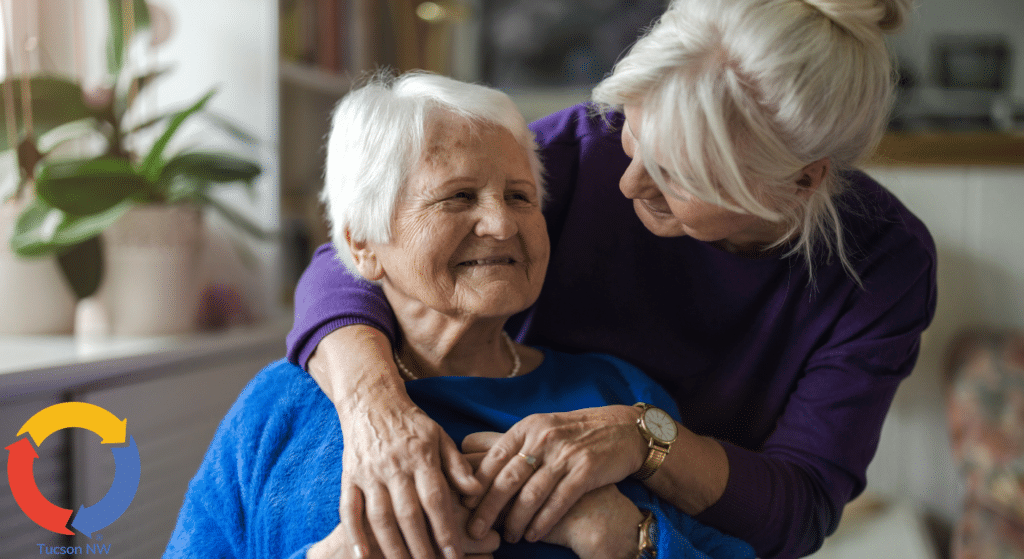 In-home caregiver embracing senior client during a compassionate care visit