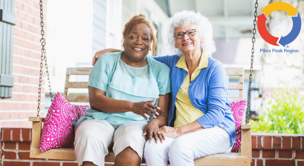 Senior companions enjoying time together on a porch swing
