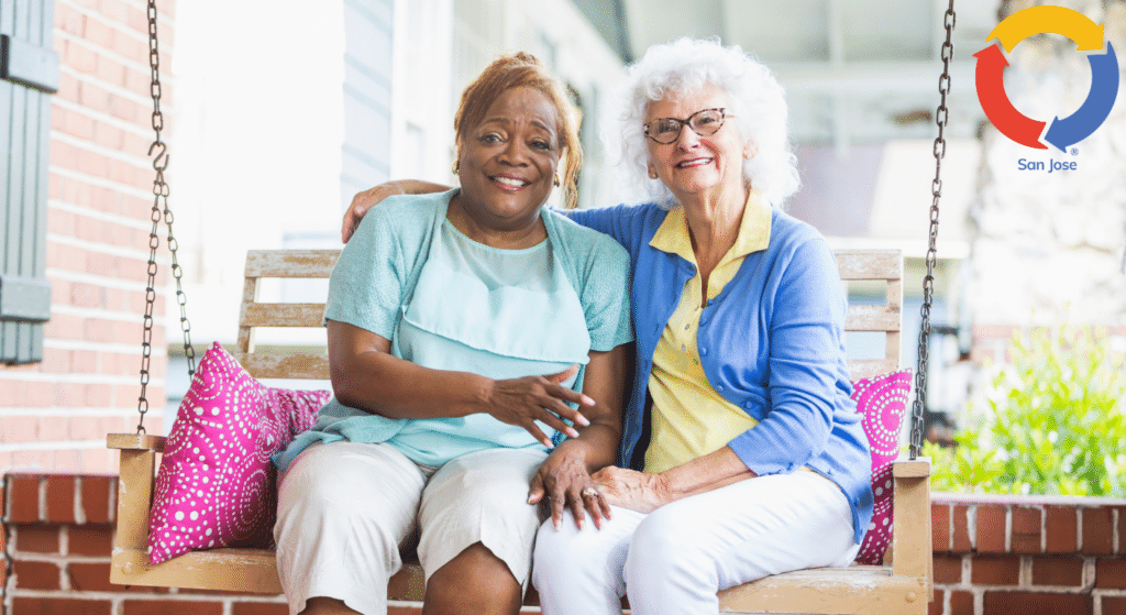 Senior companions enjoying time together on a porch swing
